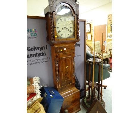 An antique flame mahogany eight day longcase clock with painted face by Hall & Co, Cardiff