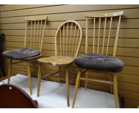 A pair of Ercol spindle back kitchen chairs together with another