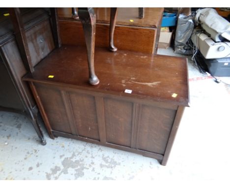 A vintage oak ottoman