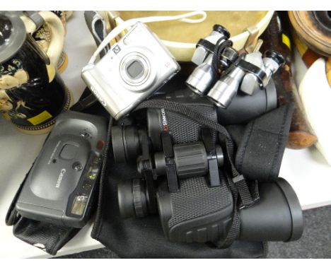 Pair of cased Simmons binoculars, two small Canon instamatic cameras, pair of Falcon miniature binoculars