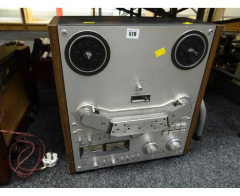 A vintage Akai four-track stereo reel-to-reel tape deck E/T