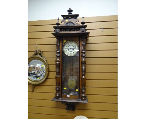 A large ornate Vienna wall clock