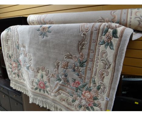 A good large Chinese washed woollen fawn & light brown coloured rug