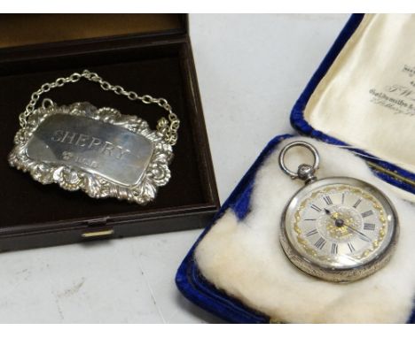 Hallmarked silver ladies' fob watch together with a hallmarked silver decanter label