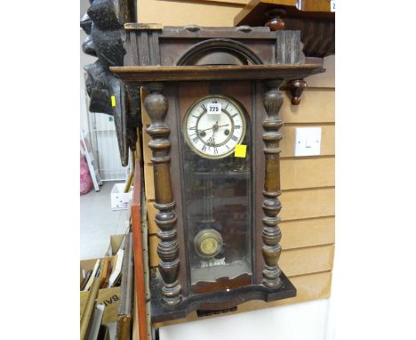 A Vienna wall clock with Roman numeral face