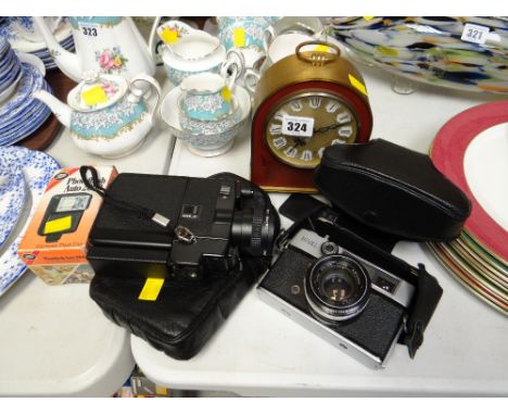 Vintage Rival camera together with a Canon camcorder, brass effect & decorated mantel clock
