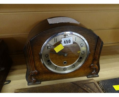 A vintage oak cased dome topped Westminster Chimes mantel clock