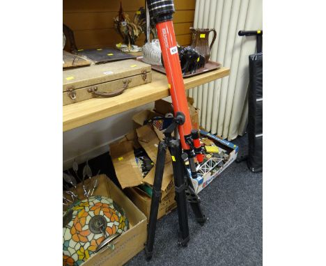 A Tasco tripod standing telescope