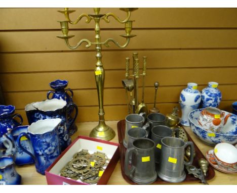 Selection of horse brasses, large brass candelabra, companion set, trivets, pewter tankards etc