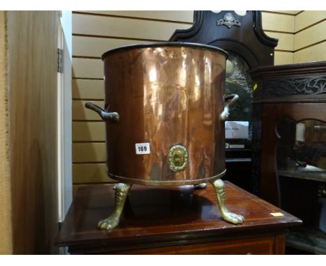 A copper & brass handled & footed planter 