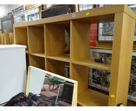 A modern lightwood shelving unit / room divider on castors & a copper fireguard