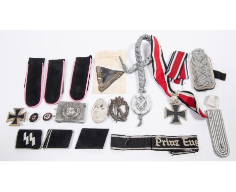 A Third Reich Army aluminium buckle; Infantry Assault badge, of die struck iron (very rusty); and various re-enactment replic