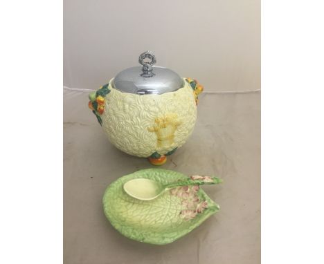 A Clarice Cliff Celtic Harvest biscuit barrel; together with a Clarice Cliff jarn set