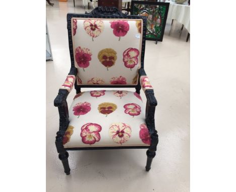 A fautelle French-style chair upholstered with pansy patterned print 