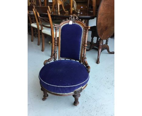 Victorian walnut navy upholstered bedroom chair on brass and ceramic castors, 80cm in overall height