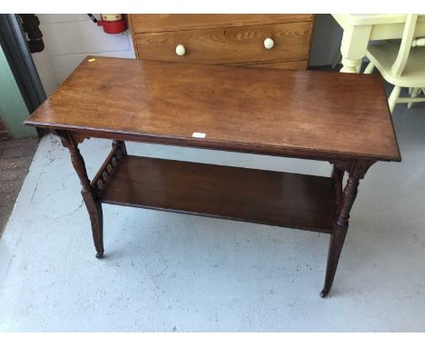 Edwardian Mahogany two tier occasional table with turned fluted column and legs on brass and ceramic castors, 114cm length, 7