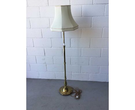 Brass standard lamp, with telescopic column and cream shade, 210cm in overall height (column extended fully)
