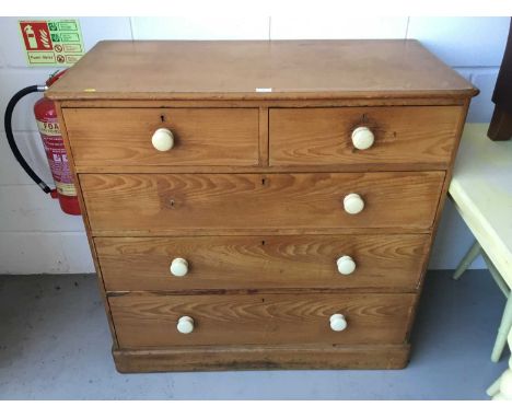 Victorian pine chest of draws, comprising two short and three long draws, with ceramic bun handles, 107cm width, 102cm height