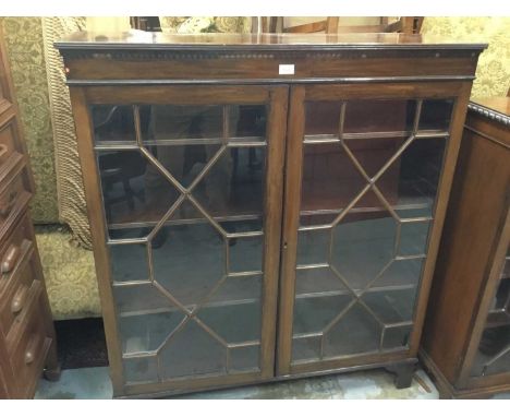 Edwardian mahogany bookcase with two astragal glazed doors on bracket feet, 107 x 121 x 31cm