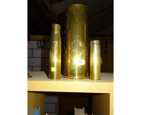 THREE VARIOUS BRASS SHELLS