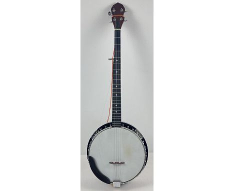 A closed back modern 5 string banjo with hard carry case. Decorative eagle design to back, 1 string needs restringing. Small 