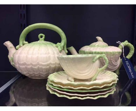 COLLECTION OF EARLY 20TH CENTURY MOULDED BELLEEK TEA WAREall in cream porcelain with hand-painted green rims, including a mou