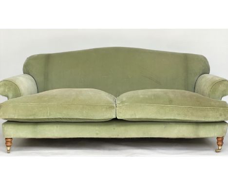 SOFA, Howard style possibly George Smith with green velvet upholstery, feather filled cushions and turned supports with casto