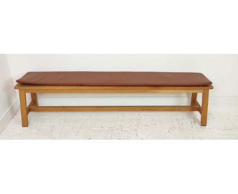 DE LA ESPADA BENCH, with tan leather cushion, 180cm L x 43cm H x 32cm W. 