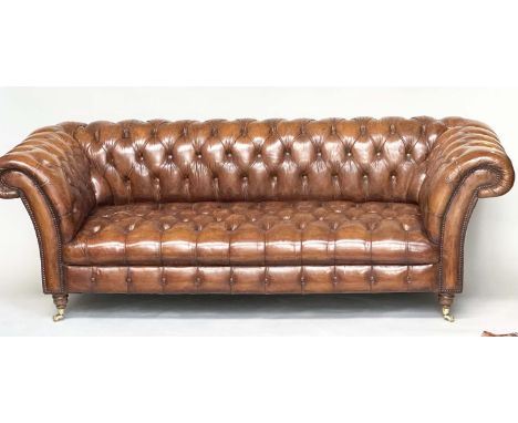 CHESTERFIELD SOFA, natural brass studded soft antique tan brown leather with deep buttoned arched back and arms, 215cm W. 