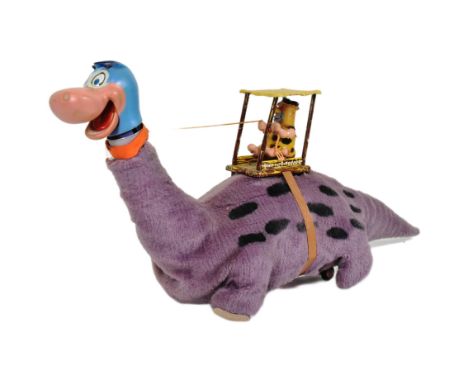 The Flintstones - a vintage 1960s Louis Marx battery operated ' Fred on Dino ' mechanical toy. Tinplate covered in a purple f