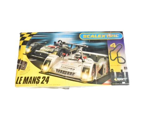 Scalextric - an original Hornby made Scalextric slot car racing set No. C1083 24 Hr Le Mans Circuit 4. The set containing one