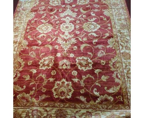 A Zeigler style carpet, with central floral design, on a red ground, contained by floral border, 280 x 200cm 