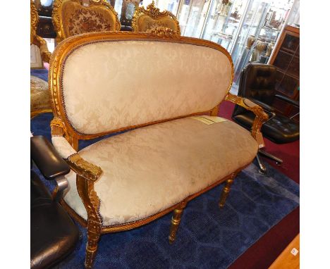 A giltwood cream upholstered sofa 