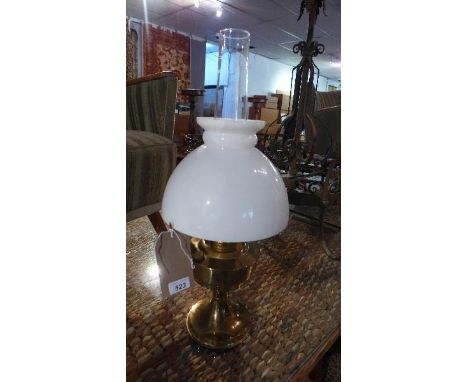 A brass oil lamp, with opaque glass shade, H.62cm 