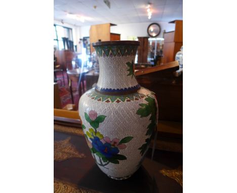 A 20th century Chinese cloisonne enamel baluster vase, with everted rim, polychrome decorated with flowers on a geometric pat