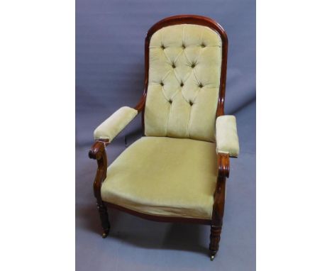 A William IV mahogany armchair, with button back velour upholstery, raised on fluted legs and castors 
