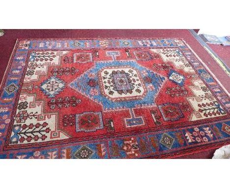 A fine North West Persian Nahawand rug, Central diamond medallion on a terracotta field within floral jade border, 198 x 140c