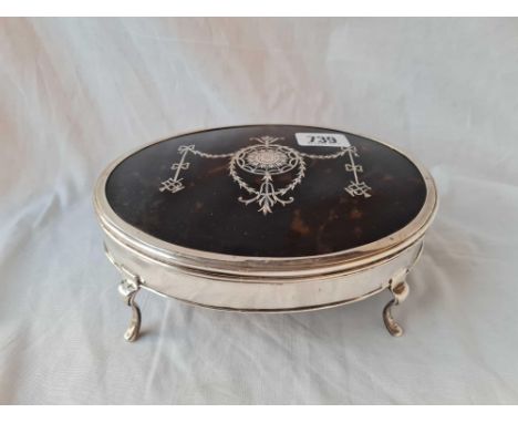 A large oval tortoise shell mounted jewellery box, standing on four pad feet, 7.5" wide, London 1917 by C &amp; R