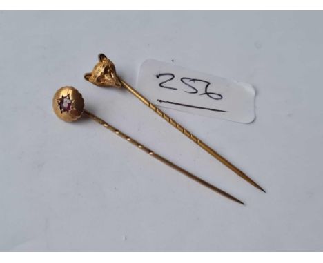 A fox head stick pin 15ct gold (metal pin) and ruby stick pin 15ct gold