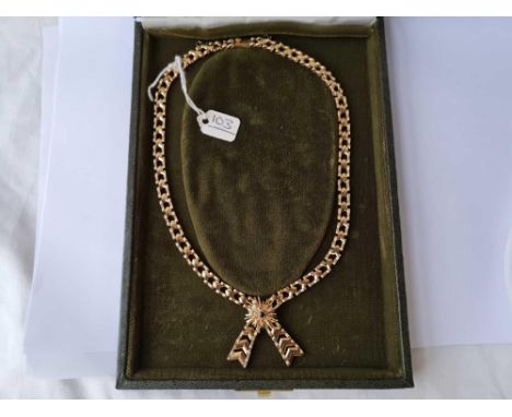 A VINTAGE GOLD NECKLACE WITH CENTRAL RUBY BOXED 9CT - 22.5 GMS 