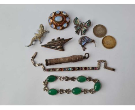 A bag of enamel coins bracelets costume jewellery etc. 