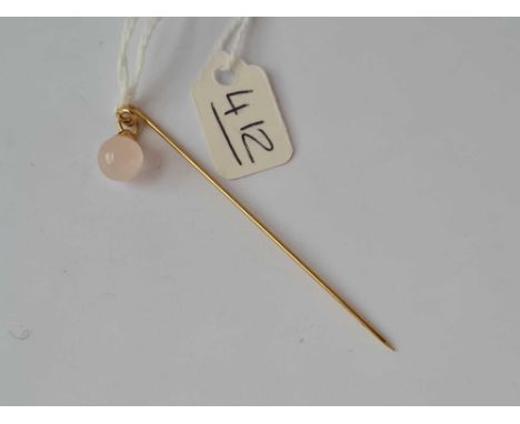 A pink quartz drop gold stick pin