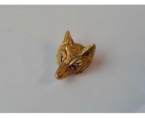 A matching fox head stick pin with ruby eyes in 9CT