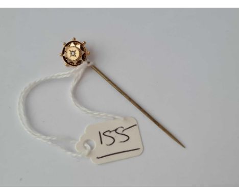 A diamond set stick pin 