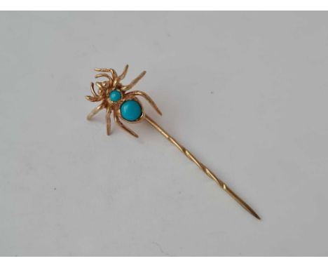 A turquoise spider stick pin set in gold - 1.4 gms