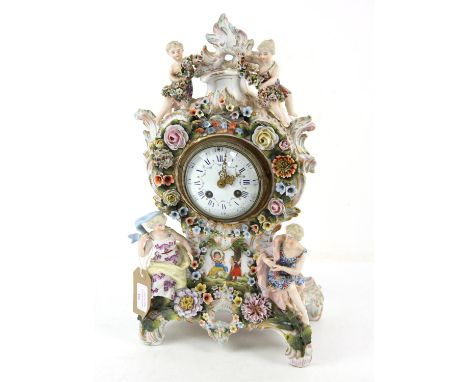Dresden floral encrusted mantel clock, applied with figures and painted with children playing, white enamel garland painted d