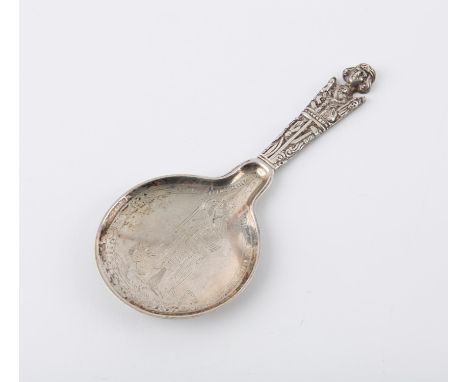 Ornate Danish silver anointing or baptismal spoon with figural handle, pictorial decoration to both sides of the bowl with a 