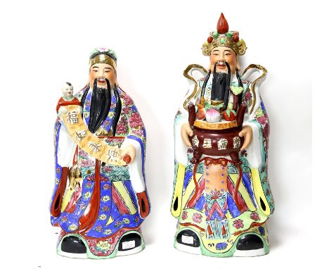 Large Chinese ceramic figures, including one a bowl of fruit and another holding a child and sash, 70 cm high