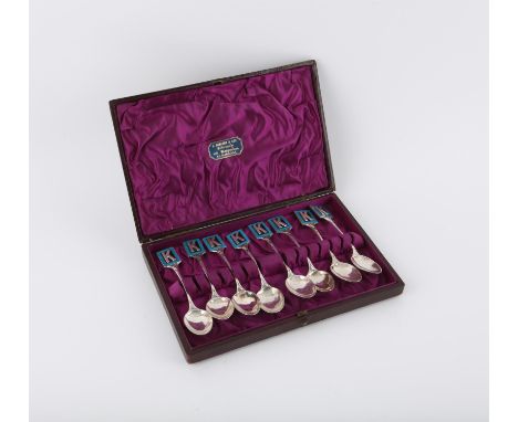 Goldsmiths and Silversmiths set of 8 silver and enamel spoons with a K on a black and blue background, Birmingham 1928-1931