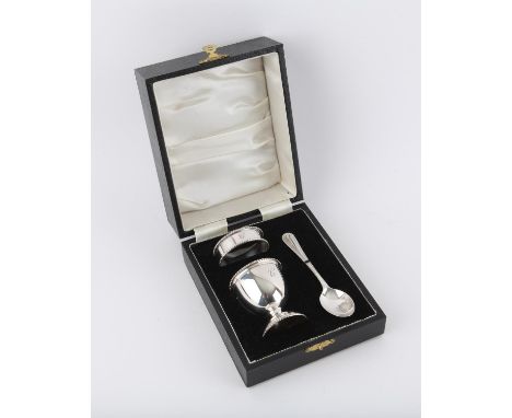 Boxed 3 piece silver christening set comprising of egg cup, napkin ring and spoon all engraved with letter C, by B and Co Bir